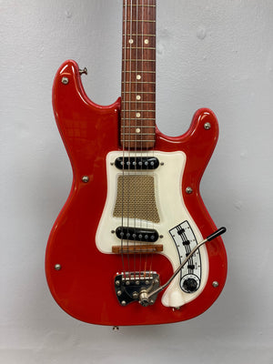 Hagstrom I vintage electric guitar with original case, featuring a red body, white and black details, and original flatwound strings.
