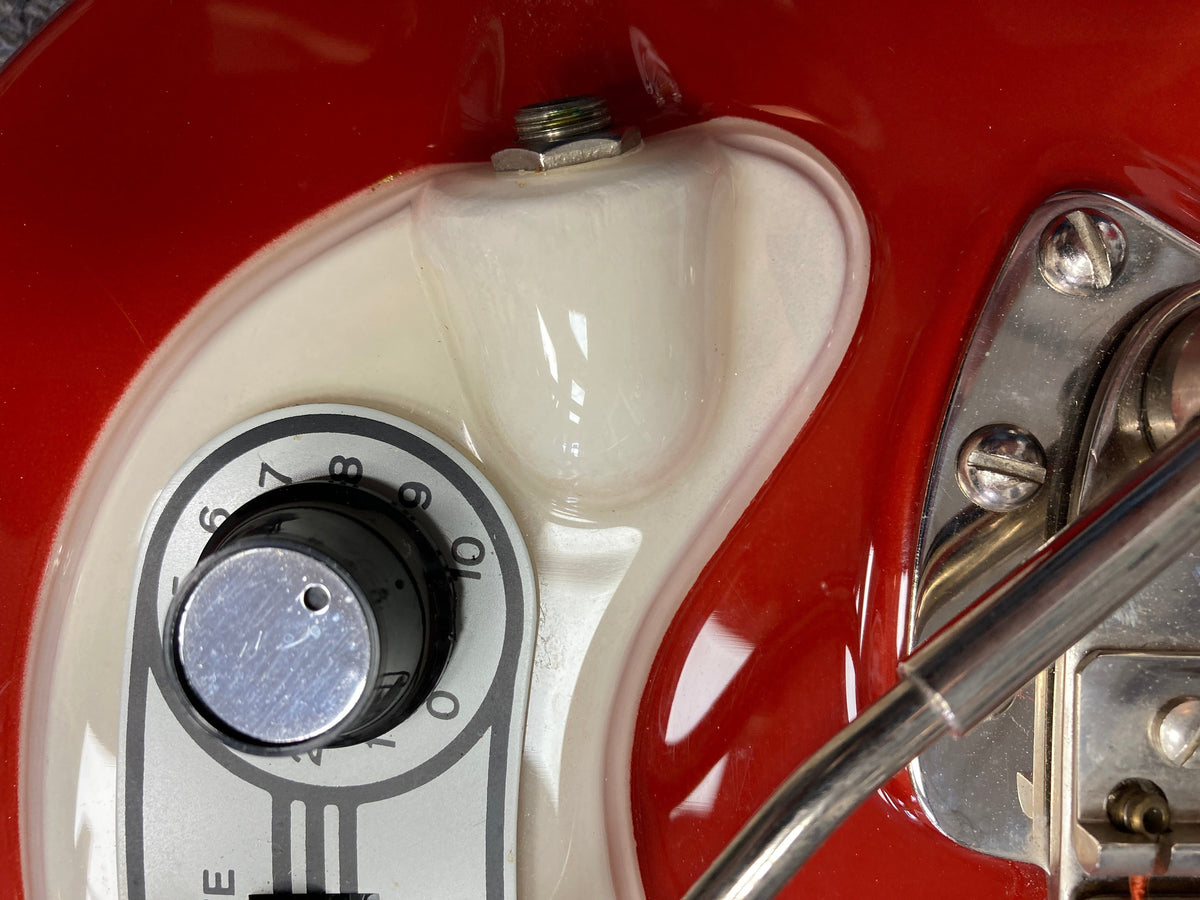 Hagstrom I Vintage Electric Guitar, red and white, close-up showing body, knobs, and strings, highlighting its pristine condition and original components.