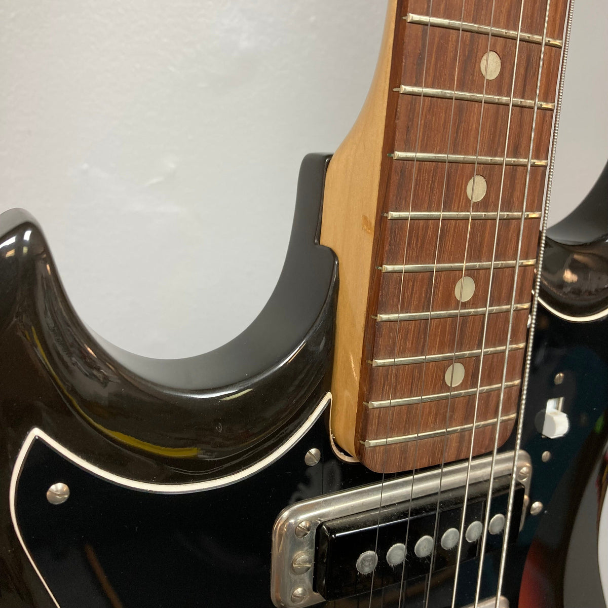 Close-up of the Hagstrom III Left Hand 1960s Sunburst Electric Guitar, showcasing its vintage-inspired design and three single-coil pickups.