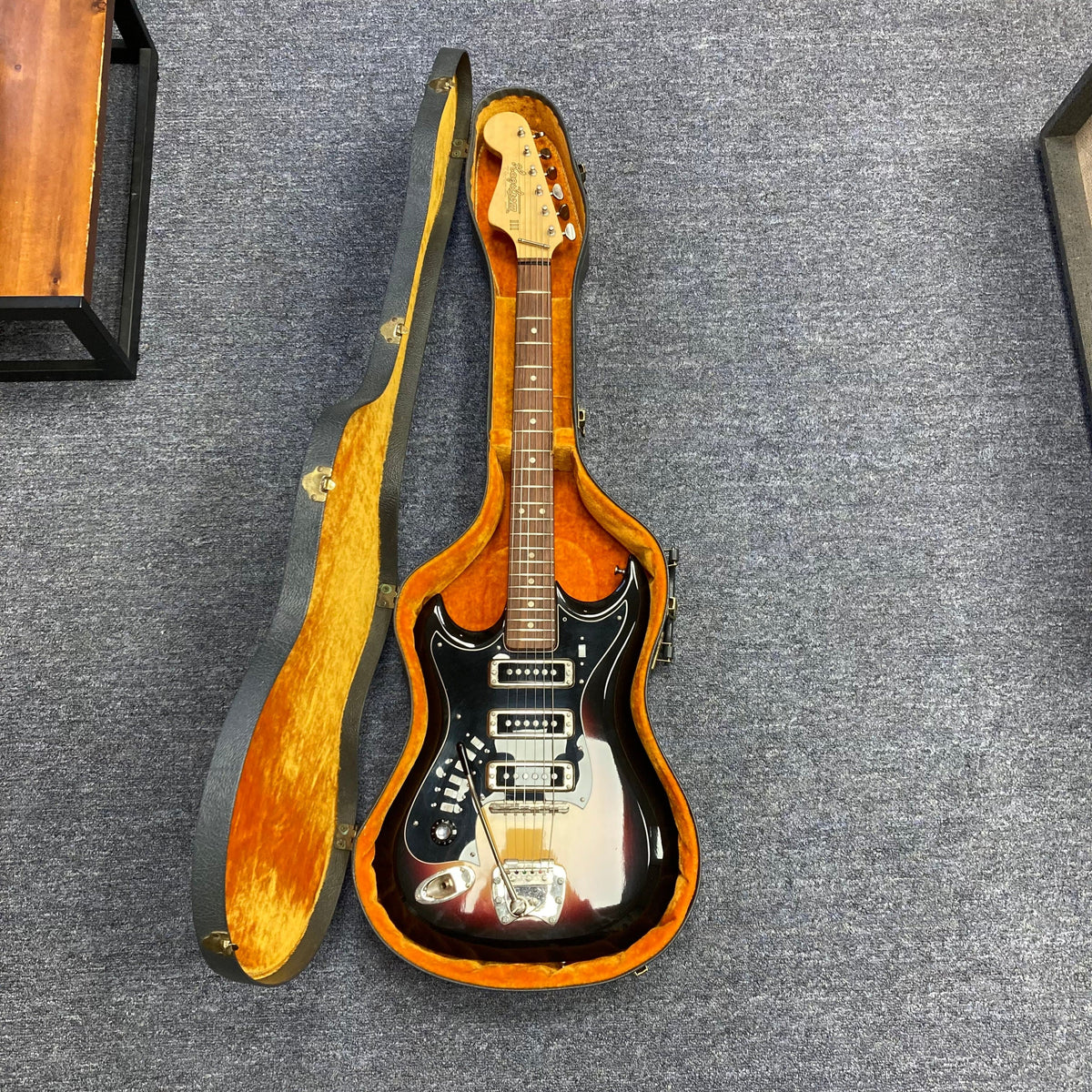 Hagstrom III Left Hand 1960s Sunburst Electric Guitar in case, featuring vintage-inspired design and three single-coil pickups for versatile tones.