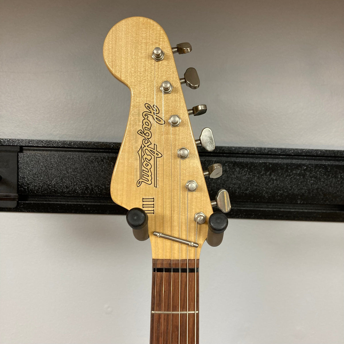 Hagstrom III Left Hand 1960s Sunburst Electric Guitar on stand, showcasing vintage design and three single-coil pickups, perfect for left-handed players.