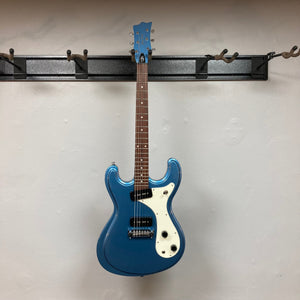 Harley Benton MR-Classic Vintage Series Metallic Blue Gloss electric guitar mounted on a wall hook.