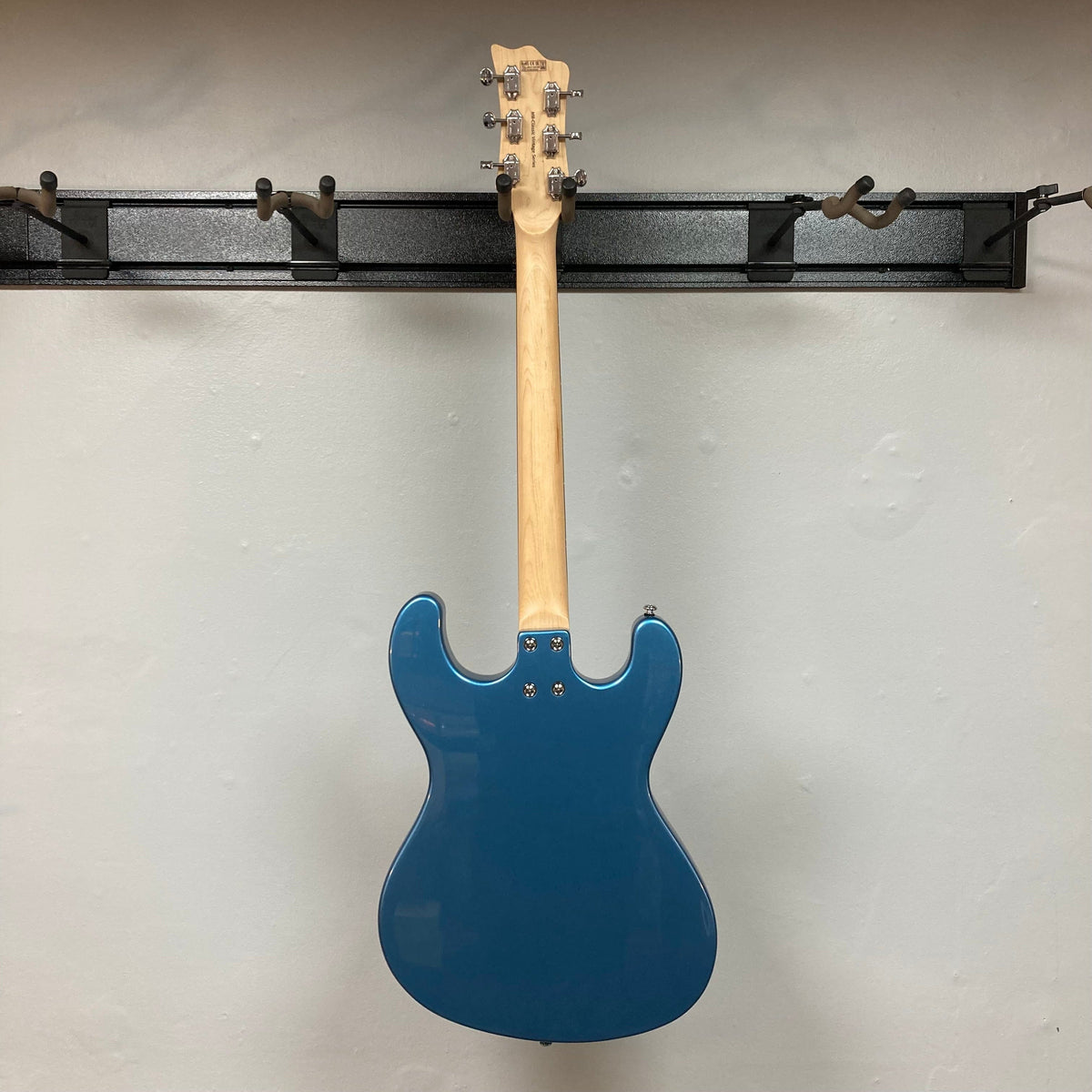 Harley Benton MR-Classic Vintage Series Metallic Blue Gloss Electric Guitar with wood neck, on display at Guitars on Main.