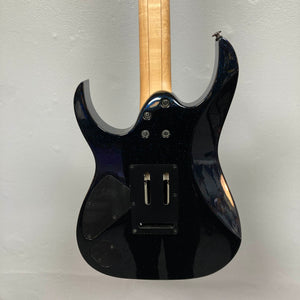 The back of the Ibanez Prestige RG1570 Cosmic Blue electric guitar features a sleek body, Wizard Prestige neck, exposed wood, and visible compartments for electronics and hardware; includes case.