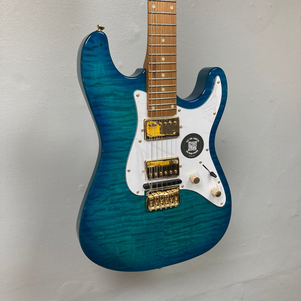 Jamstik Deluxe MIDI Blue Guitar w/Case, featuring 24 frets, MIDI capabilities, HH Pickup, locking tuners, hardtail bridge, and includes USB-C and 3.5mm TRS-MIDI cables.