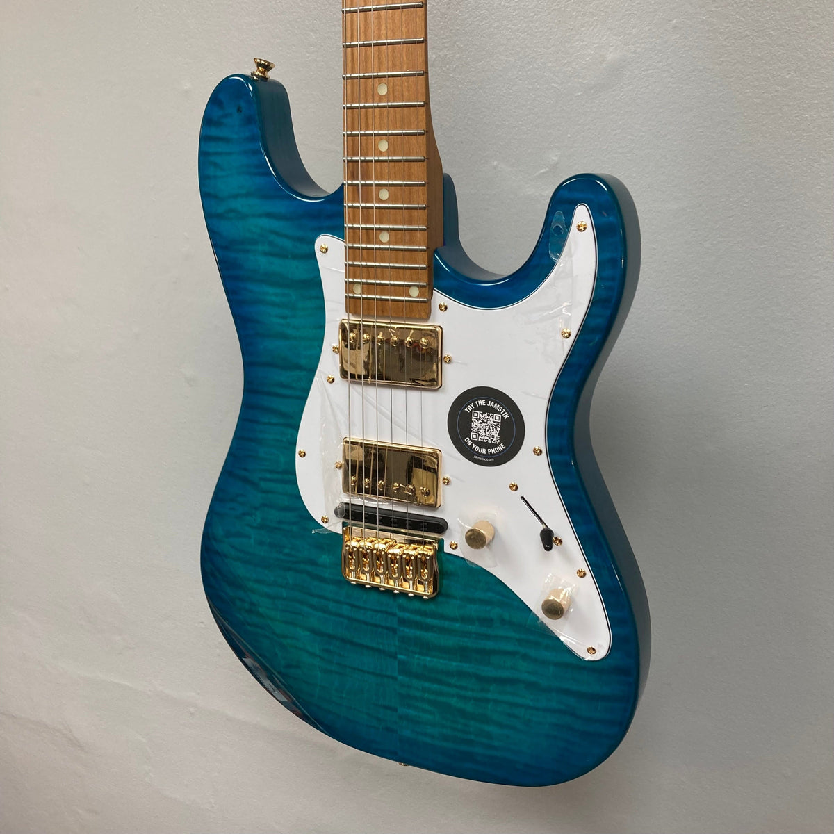 Jamstik Deluxe MIDI Blue Guitar w/Case, featuring 24 frets, HH pickups, and full MIDI capabilities, ideal for musicians and producers.