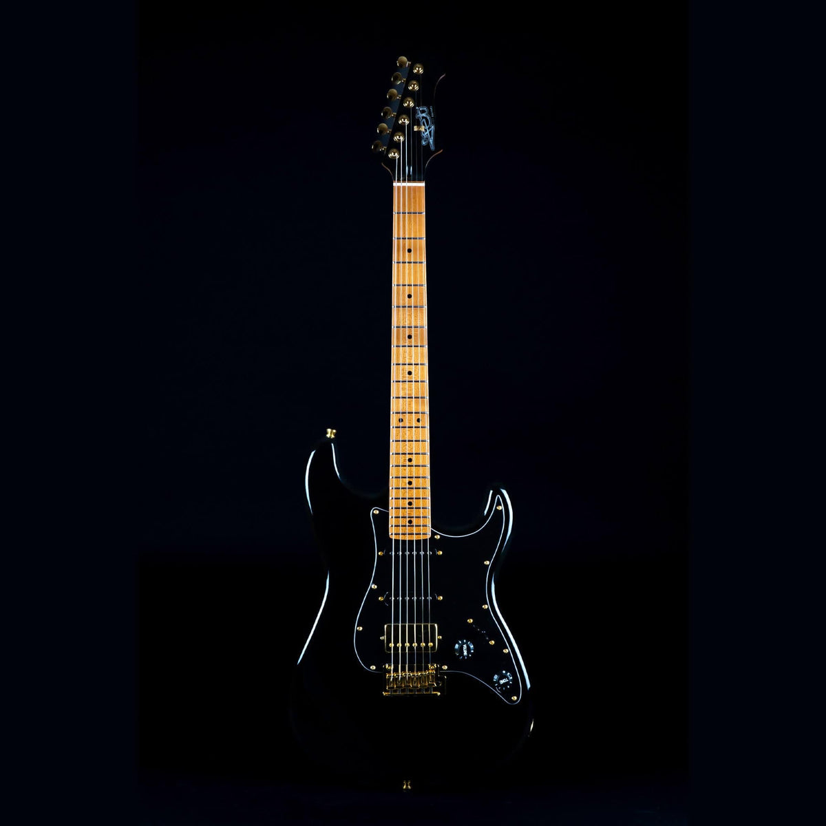 Jet JS-400 electric guitar with gold accents, highlighting versatile tone options and quality craftsmanship, ideal for various playing styles.