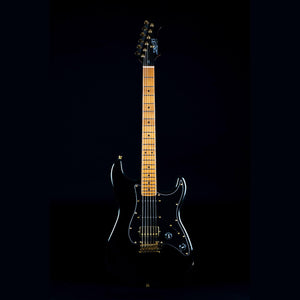 Jet JS-400 electric guitar with gold accents, highlighting versatile tone options and quality craftsmanship, ideal for various playing styles.