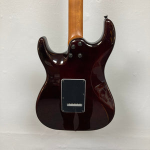 Close-up of the JET JS-450 Transparent Green guitar, featuring a flamed maple top and HSS pickup configuration, ideal for modern players seeking style and performance.