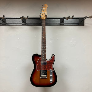 JET JT-350 guitar on a wall, showcasing its classic tone and modern design with SH Alnico pickups and a Canadian roasted maple neck.