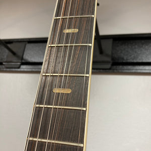 Close-up of the Kawai Vintage 1960s Teisco Japan Hound Dog Reburst guitar neck and strings.