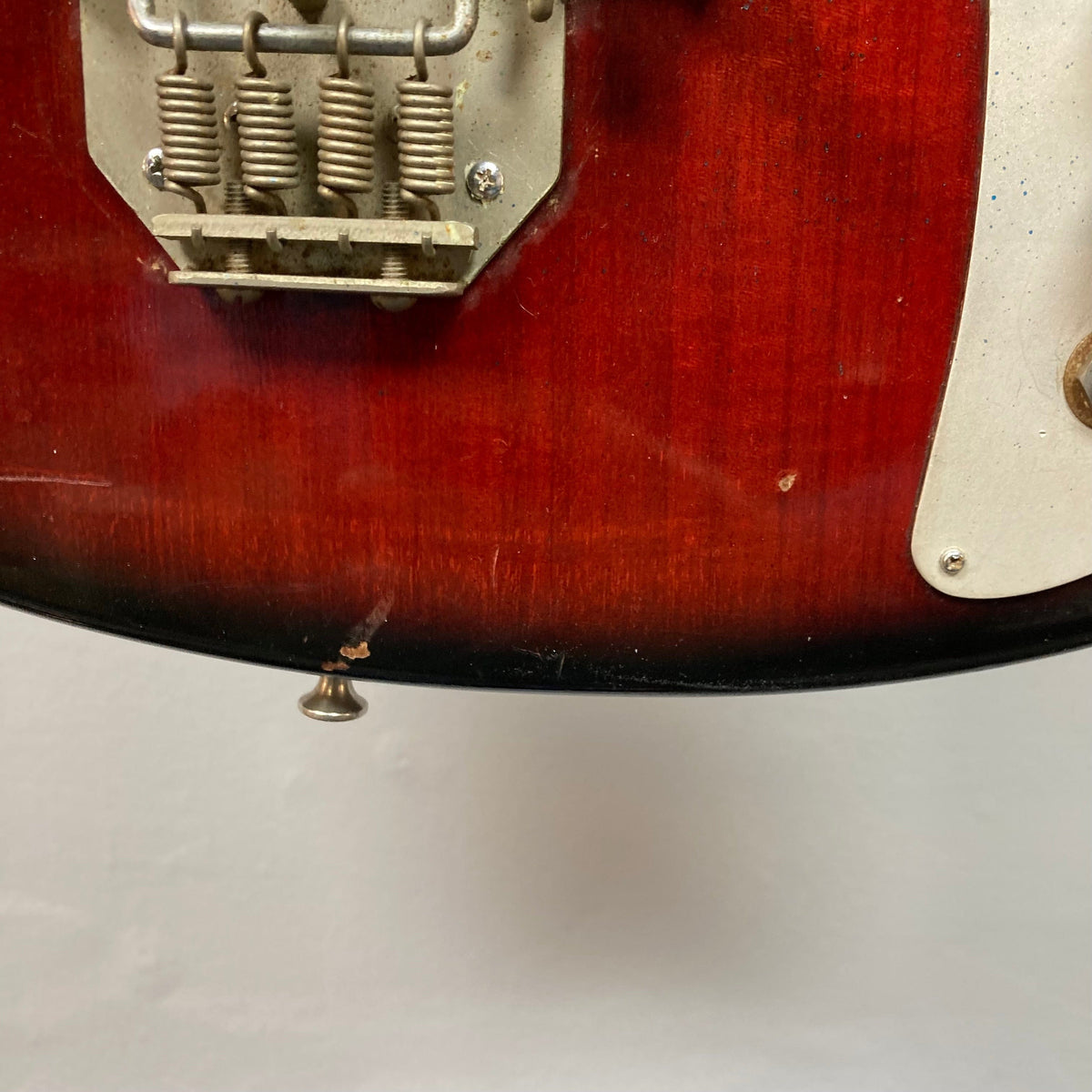Close-up of the Kawai Vintage 1960s Kawai Teisco Japan Hound Dog Reburst guitar, highlighting its distinctive craftsmanship and iconic design.