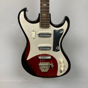 Kawai Vintage 1960s Kawai Teisco Japan Hound Dog Reburst electric guitar, featuring close-up details of strings and knobs, hanging on a wall.