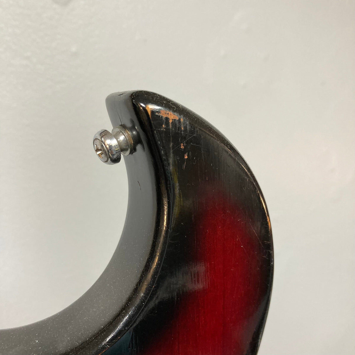 Close-up of the Kawai Vintage 1960s Kawai Teisco Japan Hound Dog Reburst guitar, showcasing its unique craftsmanship and nostalgic design.