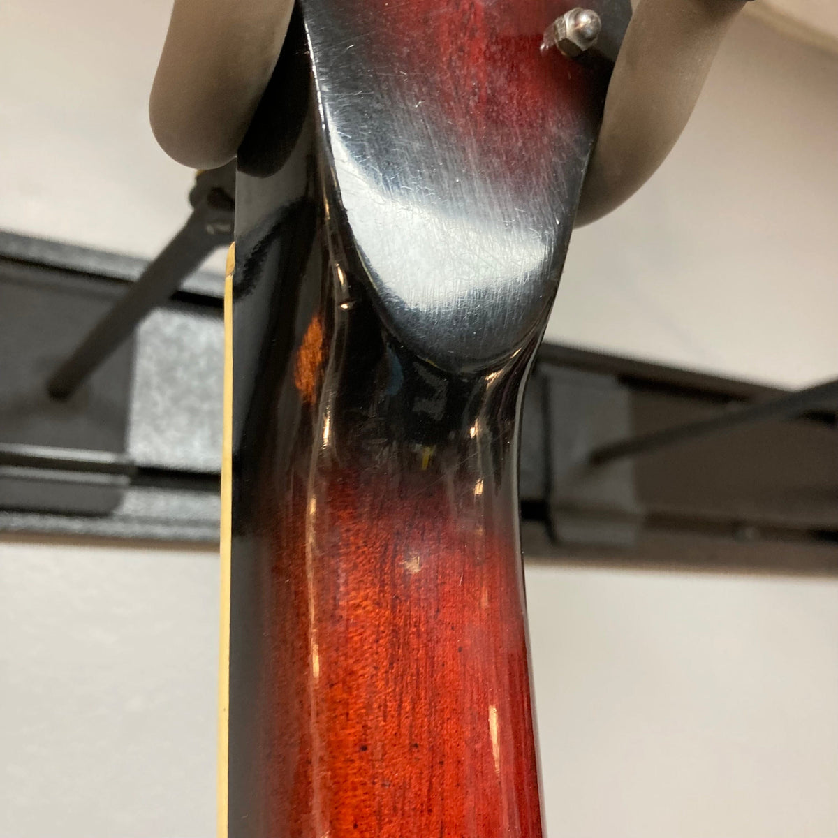 Close-up of the Kawai Vintage 1960s Kawai Teisco Japan Hound Dog Reburst guitar neck, highlighting its craftsmanship and vintage appeal.