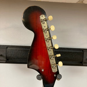 Kawai Vintage 1960s Kawai Teisco Japan Hound Dog Reburst electric guitar with multiple control knobs, showcasing a close-up of its detailed craftsmanship.