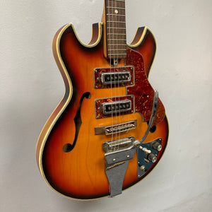 Kingston Semi-Hollowbody 1960s Vintage Burst electric guitar with visible strings, showcasing a semi-hollow design and vintage aesthetic.