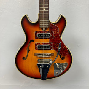 Kingston Semi-Hollowbody guitar in 1960s Vintage Burst with visible strings and semi-hollow design, embodying classic '60s aesthetics and warm, resonant sound.