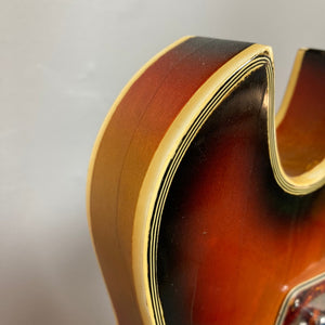 Back view of the Kingston Semi-Hollowbody 1960s Vintage Burst guitar showcasing its semi-hollow design and retro aesthetics.