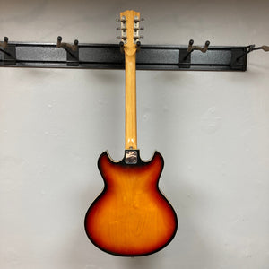 Kingston Semi-Hollowbody guitar with 1960s Vintage Burst finish, showcasing a semi-hollow design and classic styling.