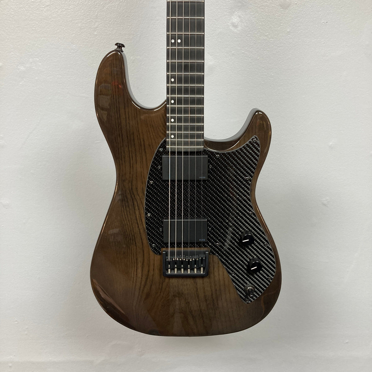 KLOS Apollo Pro Electric Guitar Dark Brown with carbon fiber neck, Ash body, and custom humbuckers, showcasing innovative design and craftsmanship.