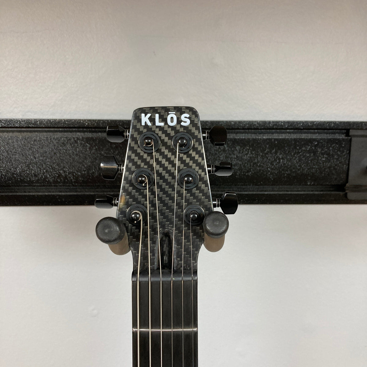 Close-up of the KLOS Apollo Pro Electric Guitar's carbon fiber neck and body, highlighting innovative design and craftsmanship for stability and enhanced playability.