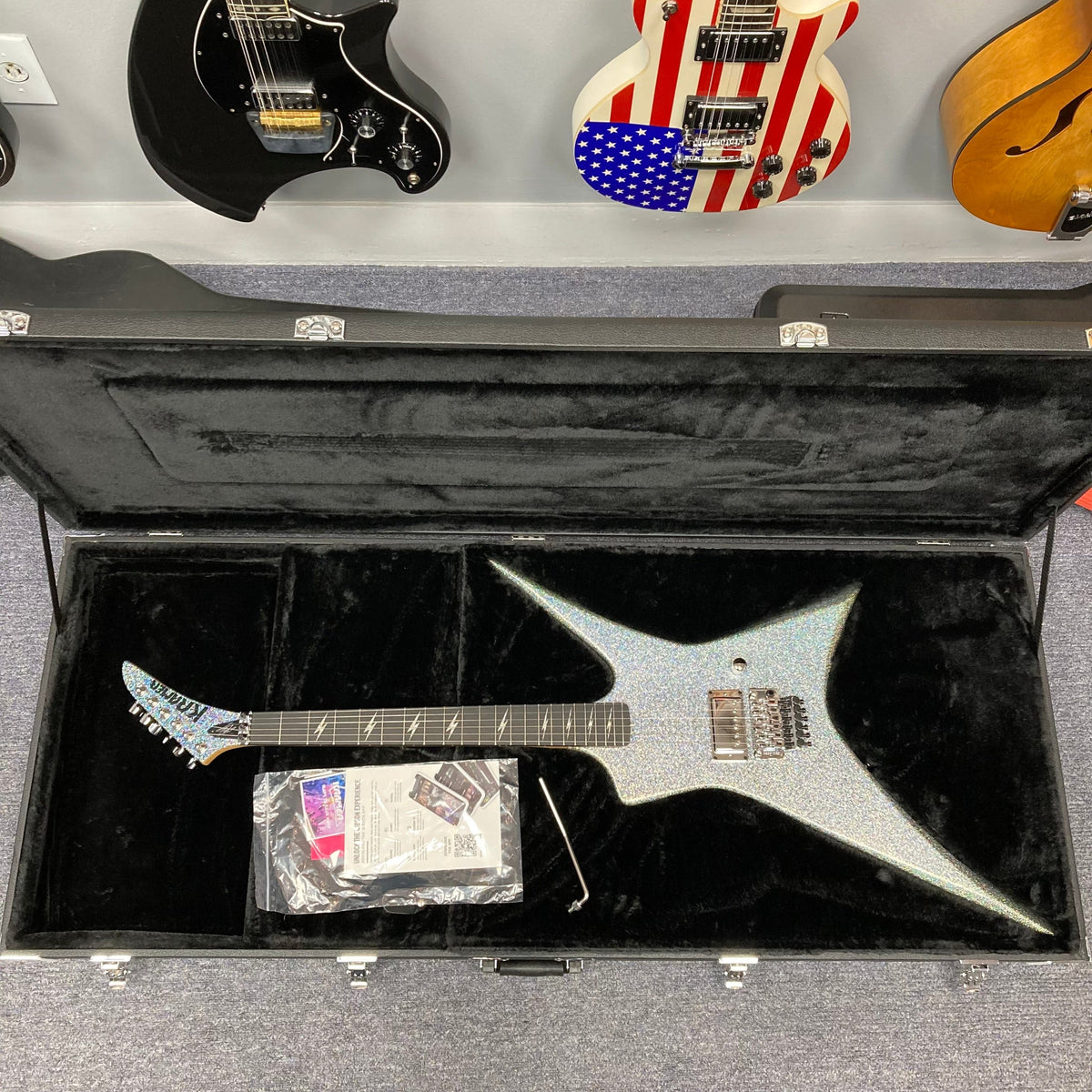 Kramer Lzzy Hale Voyager in a hardshell case, showcasing its contemporary pointy Voyager design and high-performance features tailored for rock enthusiasts.
