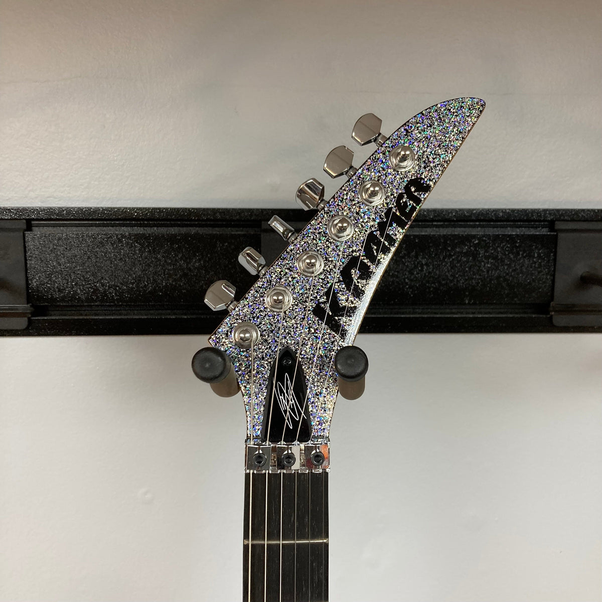Kramer Lzzy Hale Voyager guitar neck with black text, sleek design, and precise craftsmanship.