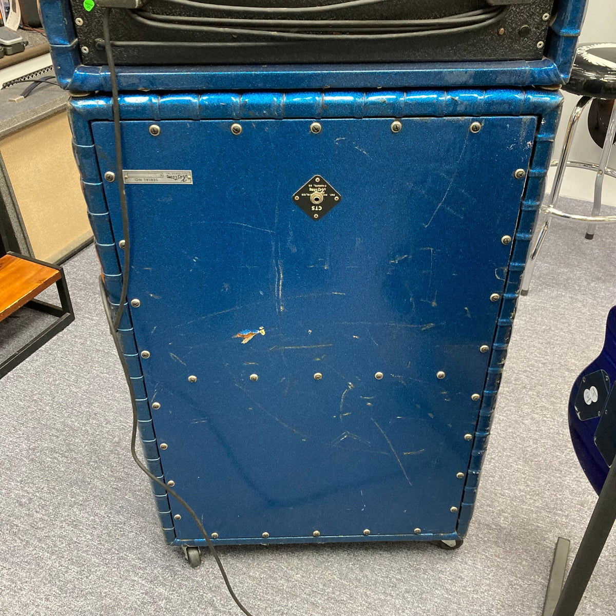 Kustom K200-B2 Blue Head and Cabinet Amp featuring black cables and a rugged, vintage-inspired design for powerful, versatile guitar amplification.