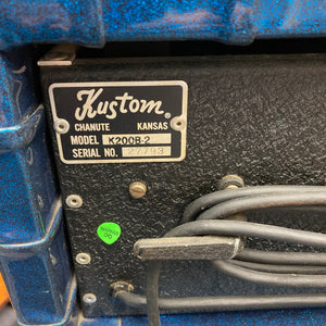 Close-up of the Kustom K200-B2 Blue Head and Cabinet Amp showcasing its control panel, cables, and vintage-inspired design.