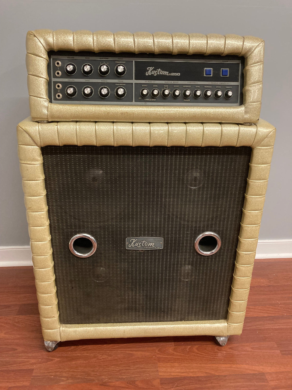 Kustom K250-4 Amp and Speaker Cabinet with gold sparkle tuck and roll design, ideal for musicians and collectors.