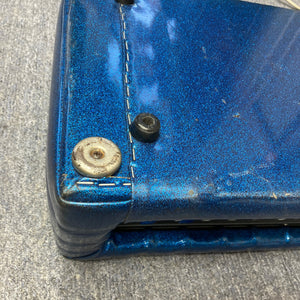 Kustom K250 Amp Head with blue sparkle tuck and roll design, featuring a round metal button, reflecting vintage style and solid-state power.