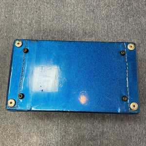 Kustom K250 Amp Head Blue Sparkle Tuck and Roll, featuring a blue body with metal rivets and a keyhole, reflecting retro style and solid-state power.