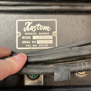 Kustom K250 Amp Head Blue Sparkle Tuck and Roll, held to showcase its retro design and solid-state power, perfect for vintage sound enthusiasts.