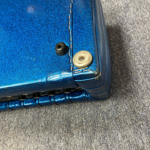 Kustom K250 Amp Head with blue sparkle tuck and roll design, featuring a close-up of the sturdy metal casing and visible screw detail.