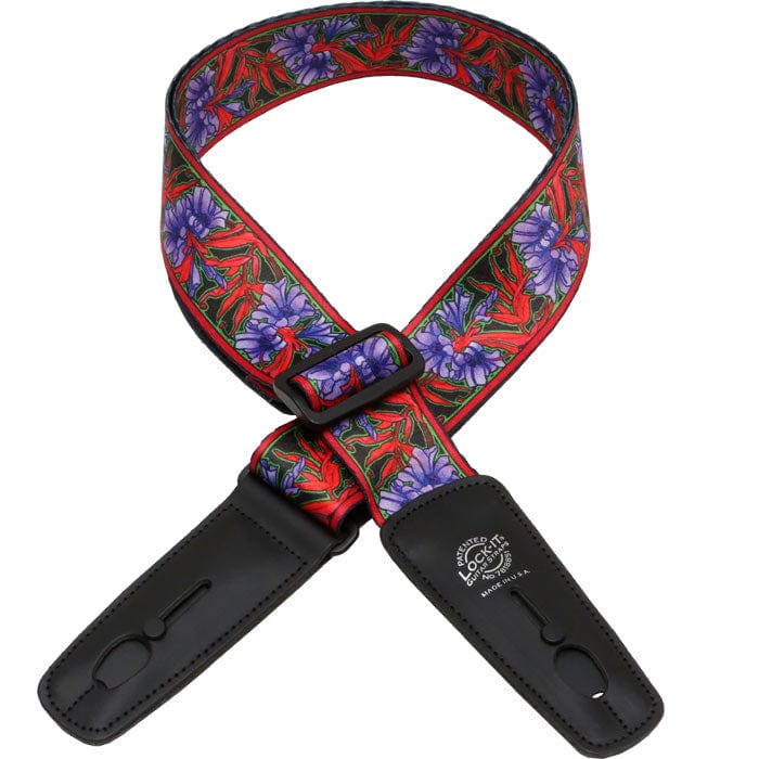 Lock-It Straps artist series by Bob Masse, featuring a colorful floral design with black leather ends and a unique locking mechanism for secure guitar performance.