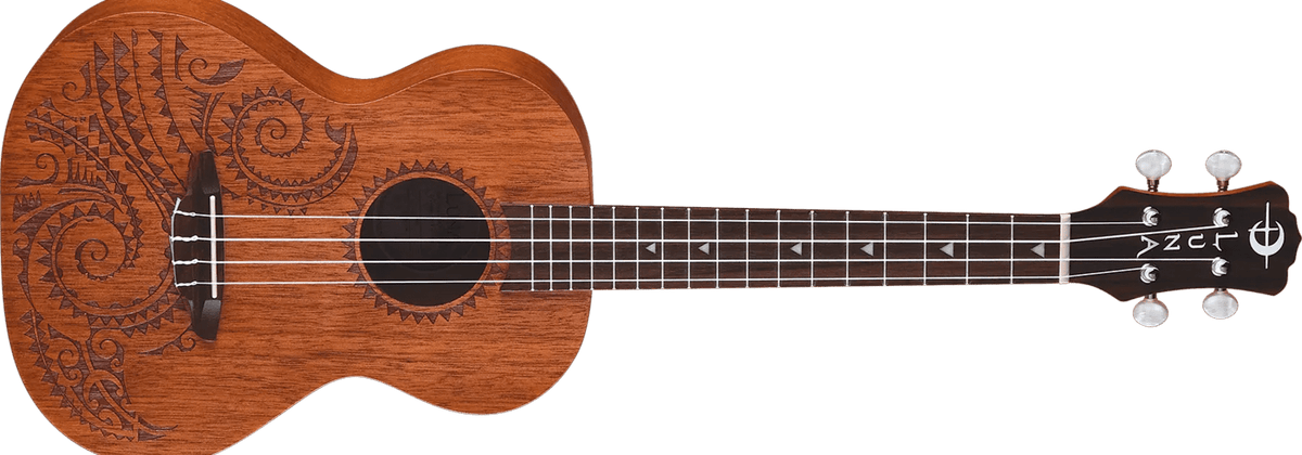 Close-up of Luna Tattoo Mahogany Tenor Ukulele featuring intricate Hawaiian wave and shark teeth laser etchings.