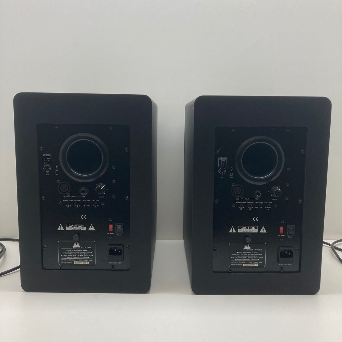 M-Audio STUDIOPHILE BX8 Monitors Set on white surface, featuring buttons and switches, ideal for music production and sound mixing. Used in good condition.
