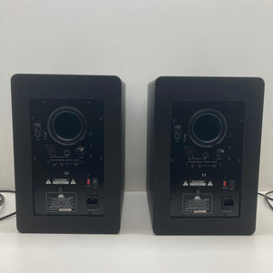 M-Audio STUDIOPHILE BX8 Monitors Set on white surface, featuring buttons and switches, ideal for music production and sound mixing. Used in good condition.
