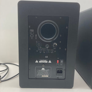 M-Audio STUDIOPHILE BX8 Monitors Set, showcasing rear panel with buttons and wires, ideal for music production and sound mixing needs.