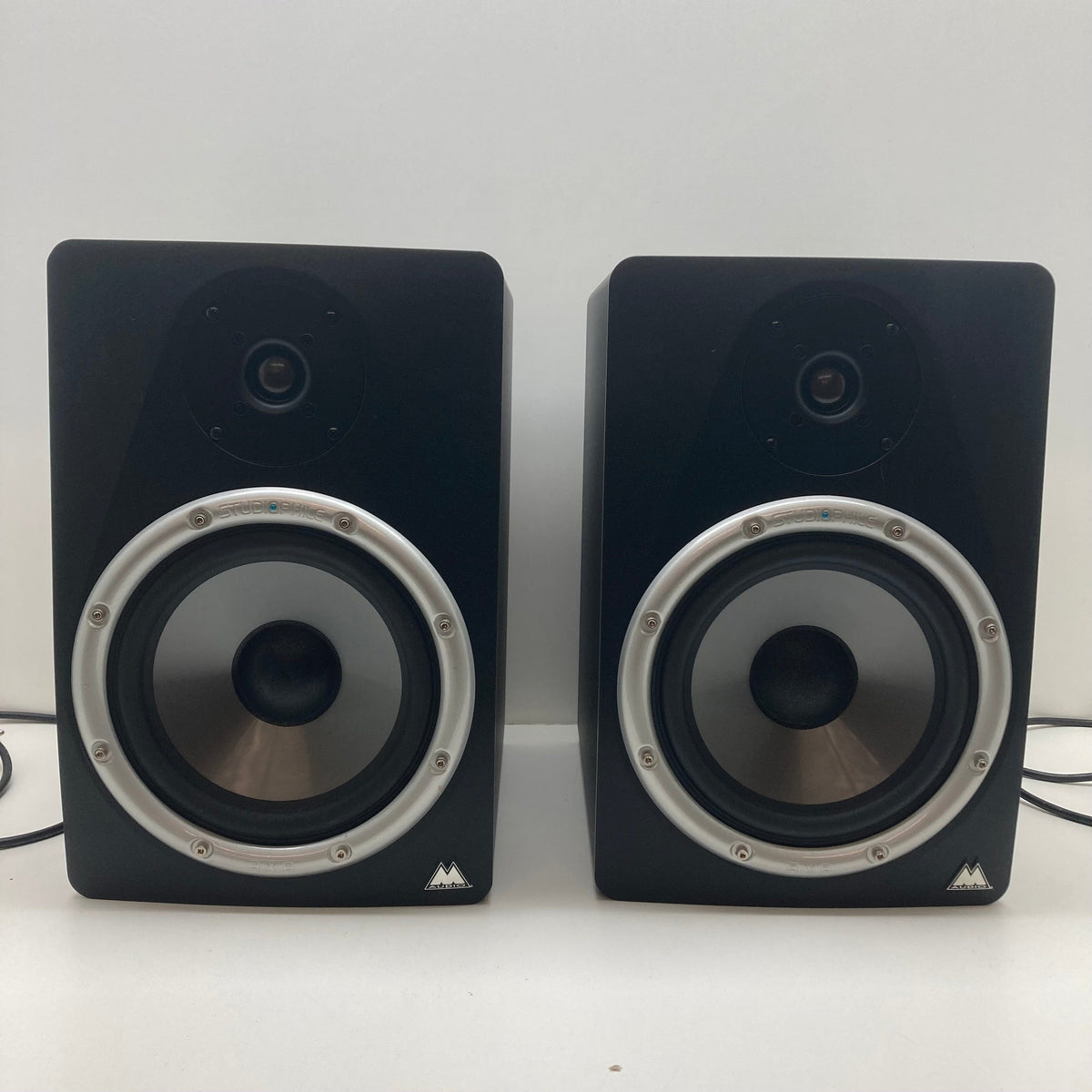 M-Audio STUDIOPHILE BX8 Monitors set on a white surface, ideal for music production and sound mixing, available in used good condition.