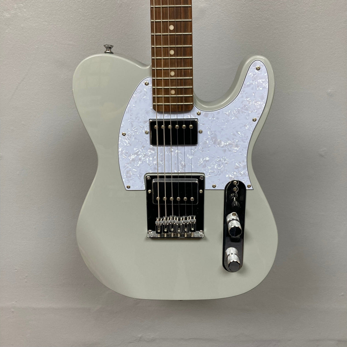 Michael Kelly 53 Tele Gloss Gray Prototype Demo, white electric guitar with brown neck, close-up of body and strings.