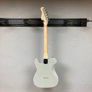 Michael Kelly 53 Tele Gloss Gray Prototype electric guitar with rainbow dots, displayed on a wall.