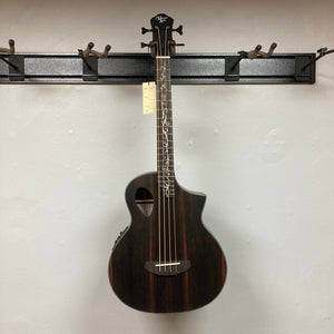 Michael Kelly Dragonfly 4 Slim Forte Port 3/4 Bass Prototype displayed on a wall hook, showcasing intricate Dragonfly inlay and ergonomic design.