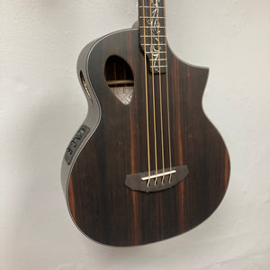 Michael Kelly Dragonfly 4 Slim Forte Port 3/4 Bass Prototype hanging on a wall, showcasing its intricate Dragonfly inlay and ergonomic design.