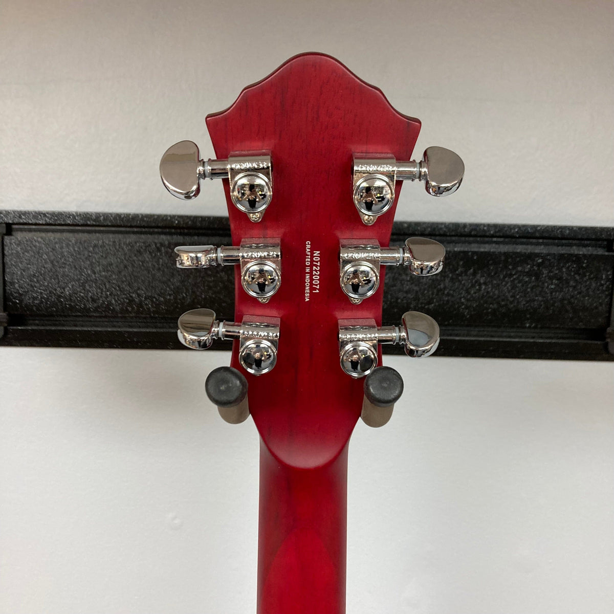Michael Kelly Patriot Decree Open Pore Slim Body Cherry Red guitar with silver knobs and two humbucker pickups.