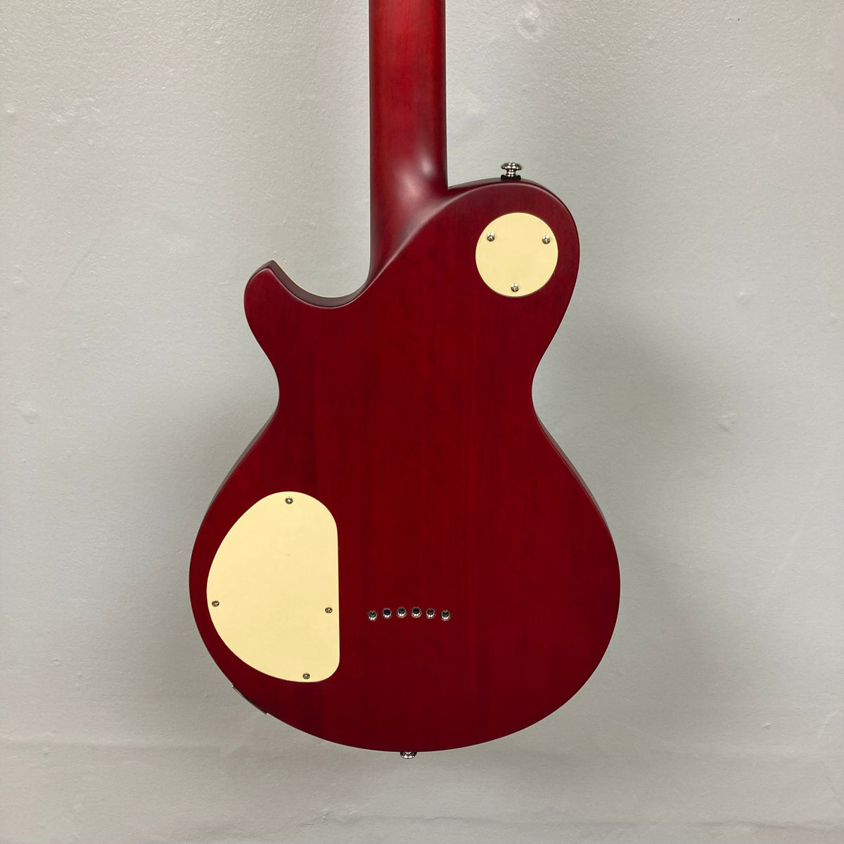 Michael Kelly Patriot Decree Open Pore Slim Body Cherry Red guitar with white dot inlays and dual humbucker pickups.