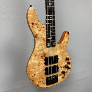 Michael Kelly Pinnacle 4 Bass close-up, highlighting the neck, strings, and intricate details of the instrument, showcasing its design and craftsmanship.