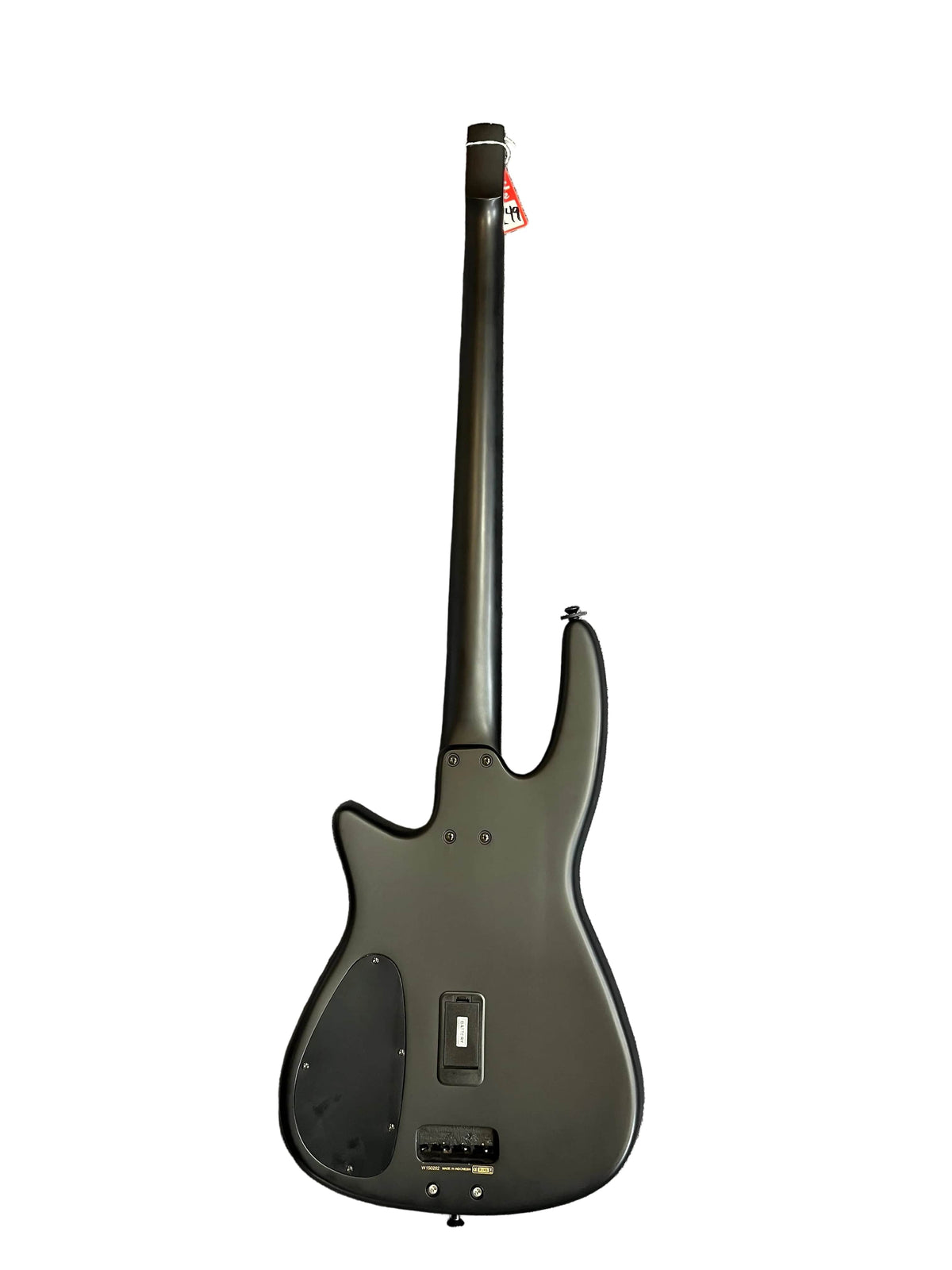 Back view of a matte black NS Design Wav Radius Bass w/NS Gigbag, showing its control cavity covers, battery compartment, and headstock tag—an ergonomic NS Design bass guitar built for punchy tones.