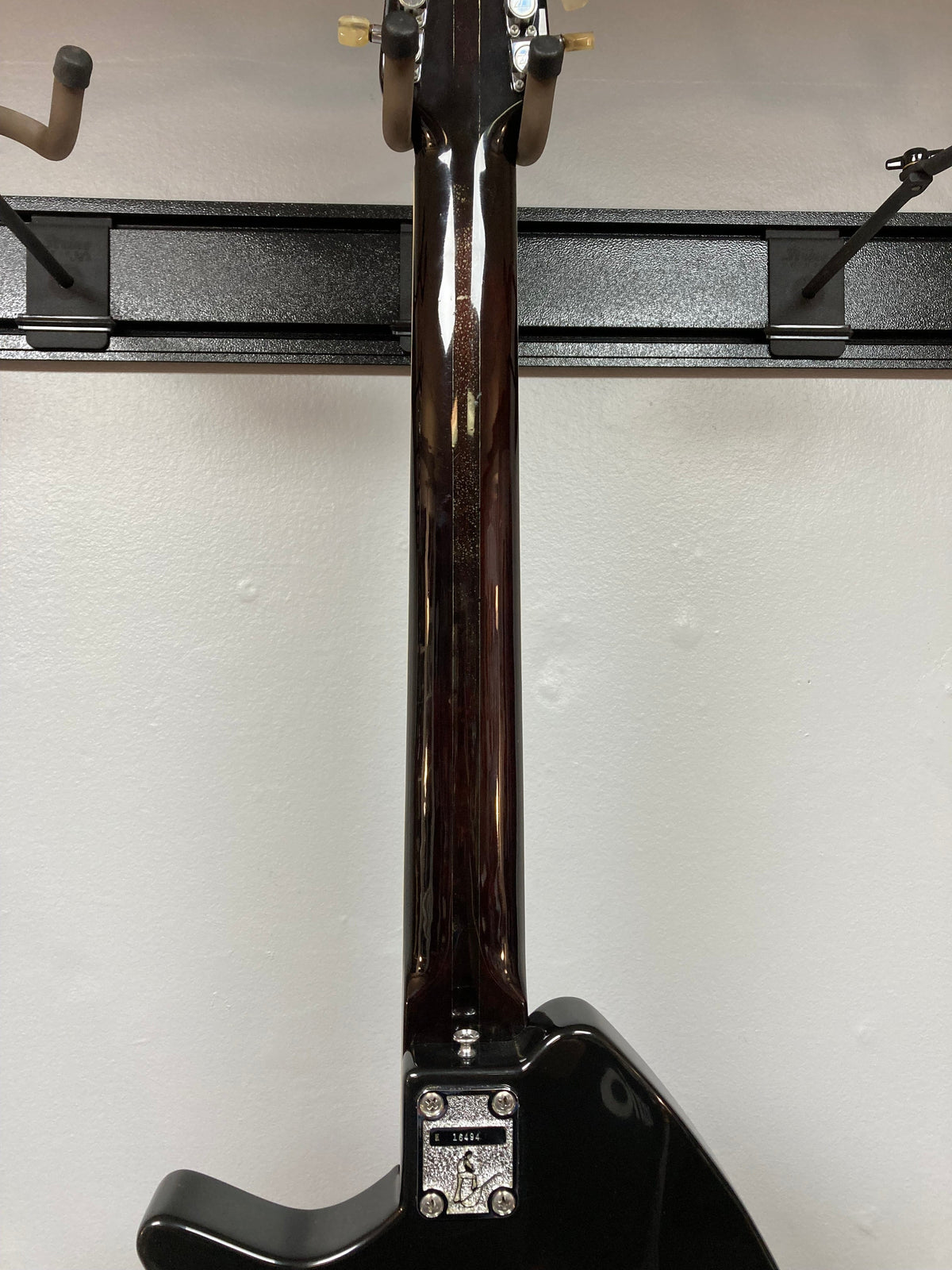 Ovation Deacon 12-String Electric Guitar, black, showcasing a solid body with visible screws and minor headstock chip.